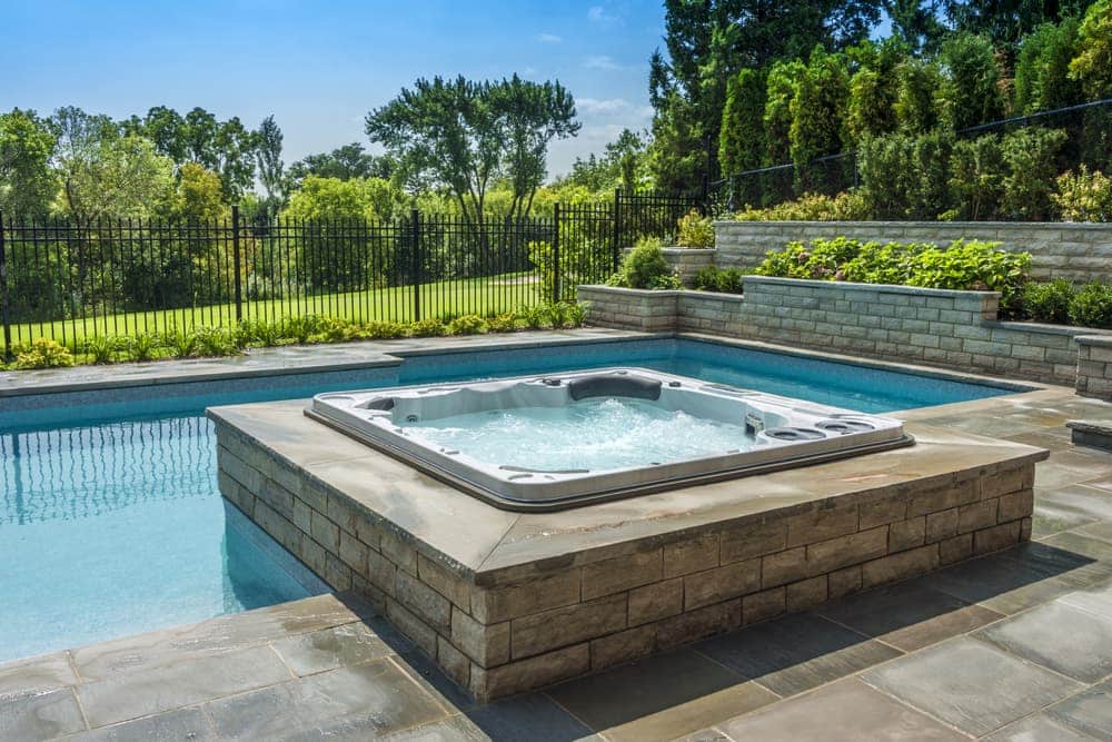 best hydropool hot tub in Pittsburgh installed near swimming pool