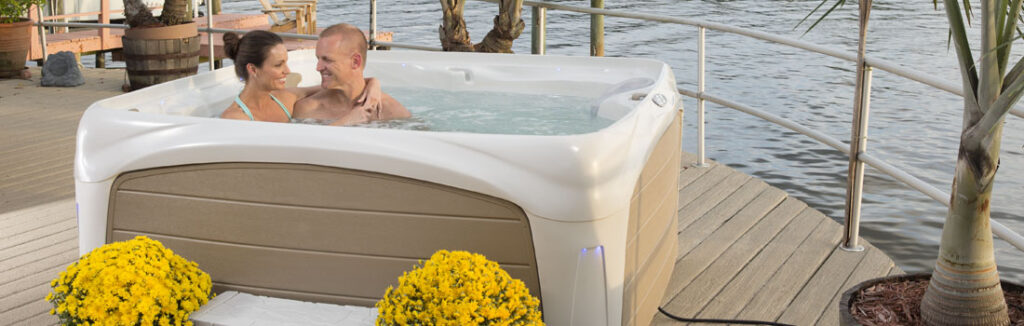 couple enjoying their time in dreammaker hot tub installed on a wooden deck in Pittsburgh 