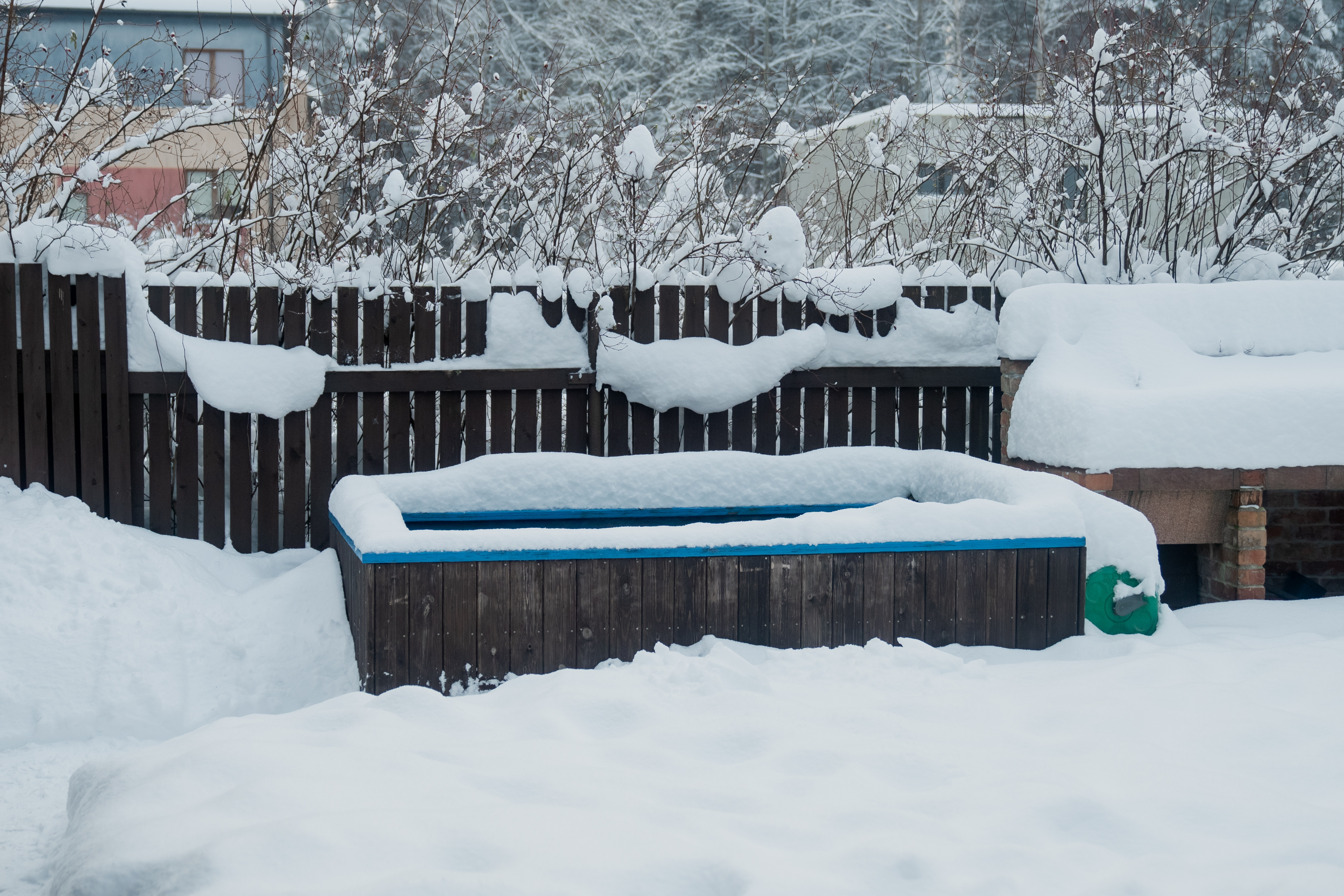 A hot tub covered in snow